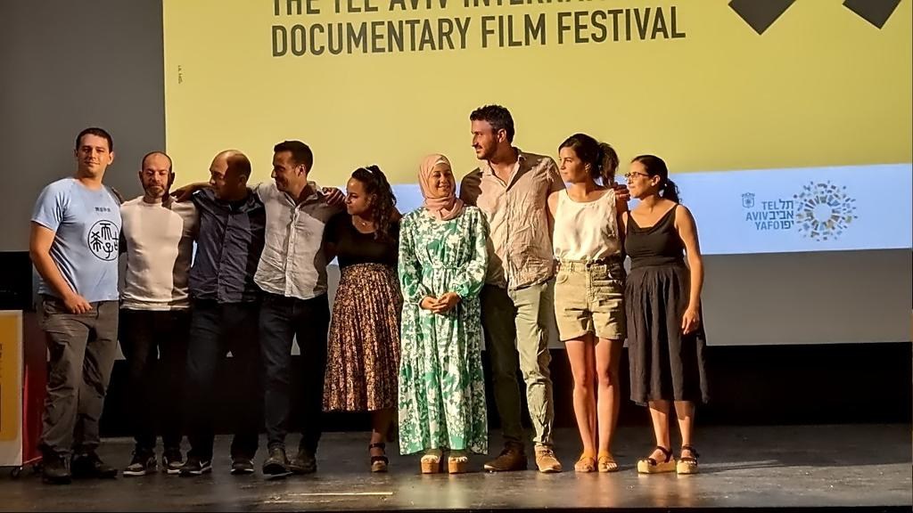 at the film festival (director and interviewees on stage)