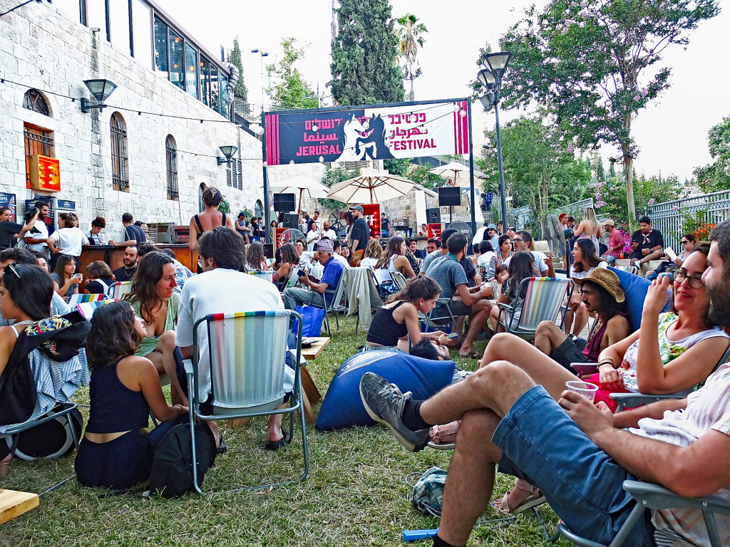 outside the cinematheque - public area with people eating, drinking